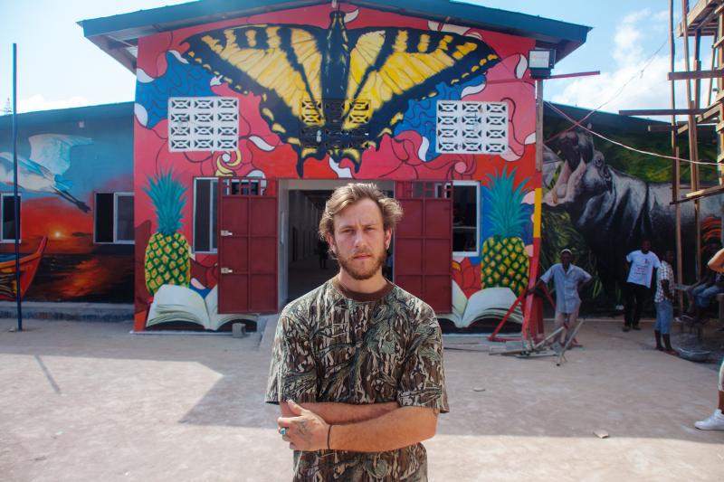 David "Nanook" Cogdill, an American street artist, came to Liberia to create a welcoming mural for a school that had been damaged by riots during the Ebola outbreak. David "Nanook" Cogdill, an American street artist, came to Liberia to create a welcoming mural for a school that had been damaged by riots during the Ebola outbreak.