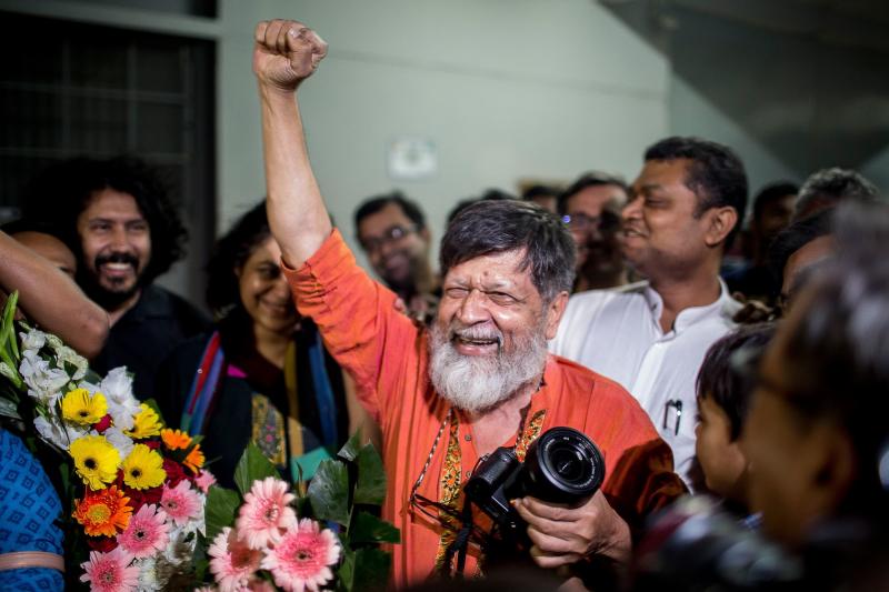 Bangladeshi photographer and activist Shahidul Alam, center, reacts as he is released from Dhaka Central Jail, Keraniganj, near Dhaka on Tuesday. Bangladeshi photographer and activist Shahidul Alam, center, reacts as he is released from Dhaka Central Jail, Keraniganj, near Dhaka on Tuesday.