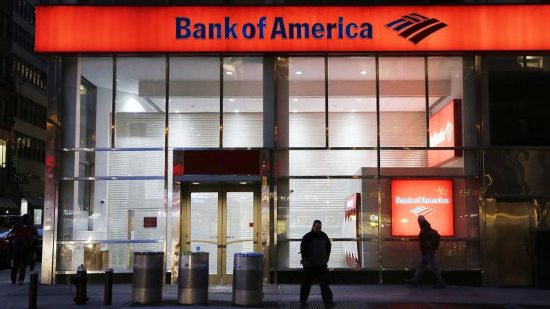 People walk past a branch of Bank of America in New York City in 2015. The bank announced Tuesday that it's raising its minimum wage to $20 an hour by 2021. People walk past a branch of Bank of America in New York City in 2015. The bank announced Tuesday that it's raising its minimum wage to $20 an hour by 2021.