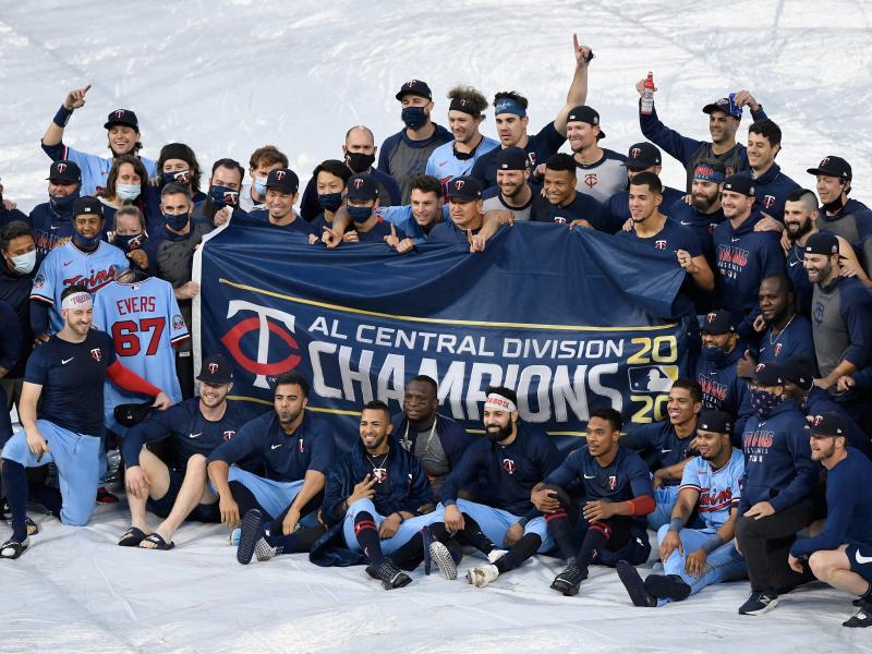 The Minnesota Twins celebrate being the American League Central Division champions after the game against the Cincinnati Reds on Sunday in Minneapolis. The Minnesota Twins celebrate being the American League Central Division champions after the game against the Cincinnati Reds on Sunday in Minneapolis.