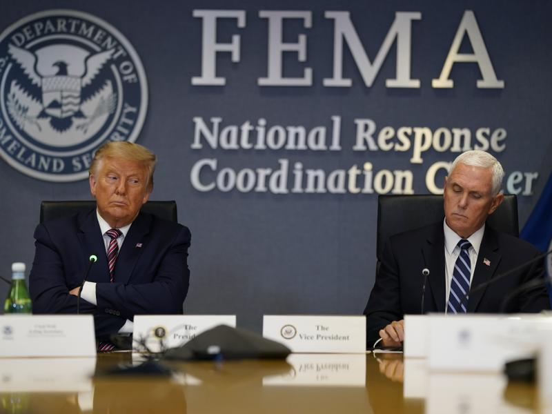 President Donald Trump and Vice President Mike Pence listen during a Hurricane Laura briefing at FEMA headquarters in Washington. President Donald Trump and Vice President Mike Pence listen during a Hurricane Laura briefing at FEMA headquarters in Washington.