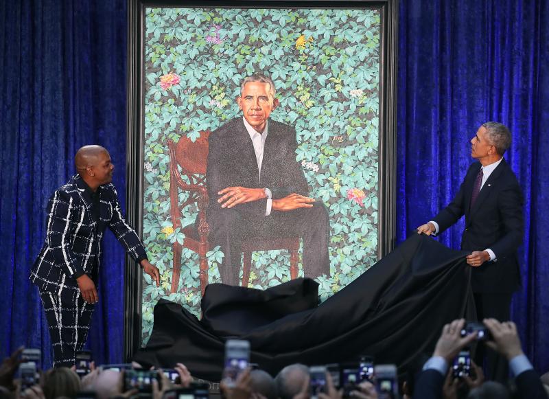 Former President Barack Obama and artist Kehinde Wiley unveil his portrait during a ceremony at the Smithsonian's National Portrait Gallery. Former President Barack Obama and artist Kehinde Wiley unveil his portrait during a ceremony at the Smithsonian's National Portrait Gallery.