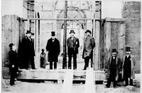 Members of the National Museum Building Committee stand in an unfinished doorway of the U.S. National Museum, now the Arts and Industries Building, in 1880. (From left: Gen. Montgomery C. Meigs, Gen. William Tecumseh Sherman, Peter Parker, Spencer Fullert Members of the National Museum Building Committee stand in an unfinished doorway of the U.S. National Museum, now the Arts and Industries Building, in 1880. (From left: Gen. Montgomery C. Meigs, Gen. William Tecumseh Sherman, Peter Parker, Spencer Fullert