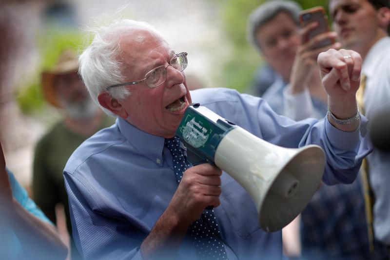 Democratic presidential candidate Sen. Bernie Sanders speaks to an overflow crowd through a megaphone after a campaign event May 27, 2015, at New England College in Concord, N.H. Democratic presidential candidate Sen. Bernie Sanders speaks to an overflow crowd through a megaphone after a campaign event May 27, 2015, at New England College in Concord, N.H.