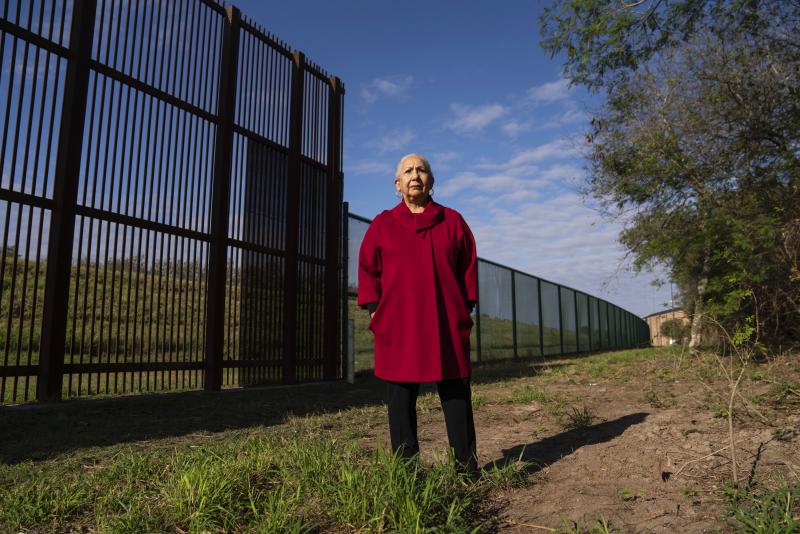Juliet García, former president of the University of Texas at Brownsville, stands behind the border wall. Juliet García, former president of the University of Texas at Brownsville, stands behind the border wall.