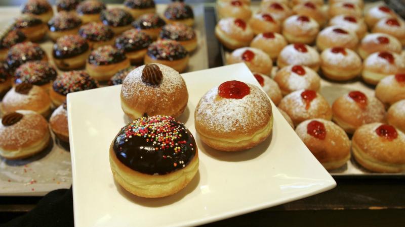 Jews commemorate Hanukkah by eating fried foods. For most American Jews, that means latkes — potato pancakes fried in oil. But other cultures toss different foods into pots of boiling oil. Take, for example, these fried and jam-filled doughnuts, called Jews commemorate Hanukkah by eating fried foods. For most American Jews, that means latkes — potato pancakes fried in oil. But other cultures toss different foods into pots of boiling oil. Take, for example, these fried and jam-filled doughnuts, called