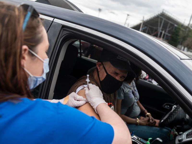 A nurse administers a COVID-19 vaccine in Ridgeway, Va., in March. A nurse administers a COVID-19 vaccine in Ridgeway, Va., in March.