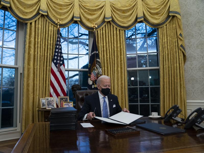 President Biden signs executive actions hours after his inauguration on Wednesday. He is expected to reverse several Trump-era policies. President Biden signs executive actions hours after his inauguration on Wednesday. He is expected to reverse several Trump-era policies.