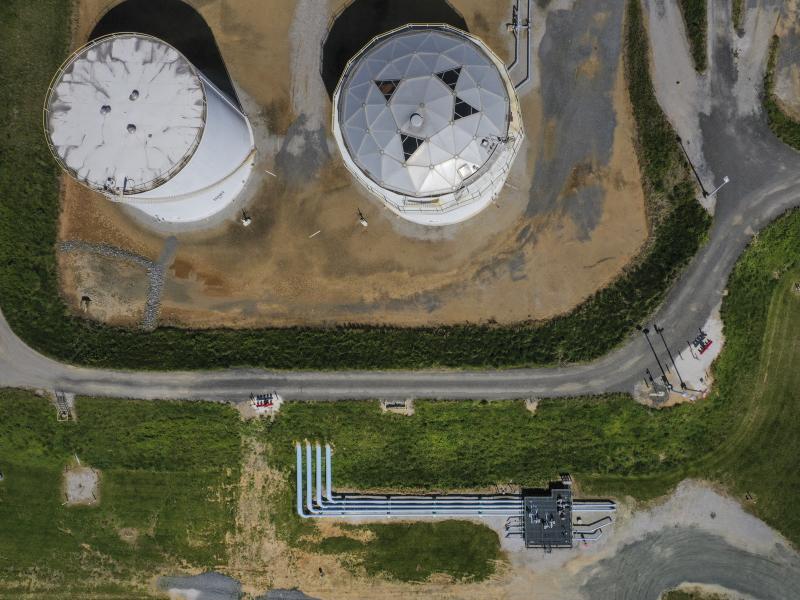 Fuel holding tanks are pictured at Colonial Pipeline's Dorsey Junction Station in Woodbine, Maryland in May 2021, the month that a cyberattack disrupted gas supply to the eastern U.S. for several days. Fuel holding tanks are pictured at Colonial Pipeline's Dorsey Junction Station in Woodbine, Maryland in May 2021, the month that a cyberattack disrupted gas supply to the eastern U.S. for several days.