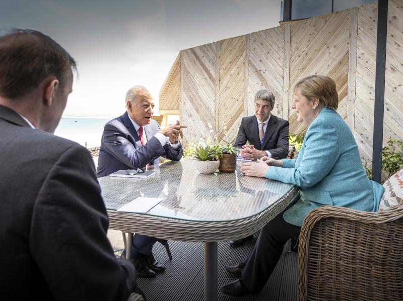 President Biden meets with German Chancellor Angela Merkel on the sidelines of the G-7 summit. A White House official said Biden did a lot of "diplomatic speed-dating" with world leaders. President Biden meets with German Chancellor Angela Merkel on the sidelines of the G-7 summit. A White House official said Biden did a lot of "diplomatic speed-dating" with world leaders.