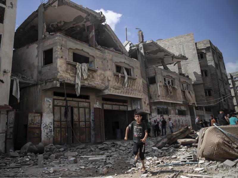 Palestinians inspect damaged houses that were hit early Monday in Israeli airstrikes in Gaza City, Gaza Strip. Palestinians inspect damaged houses that were hit early Monday in Israeli airstrikes in Gaza City, Gaza Strip.