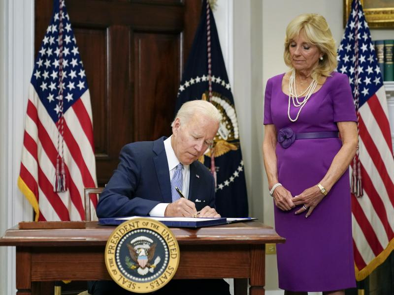 President Biden signs into law the Bipartisan Safer Communities Act gun safety bill, in the Roosevelt Room of the White House on Saturday as first lady Jill Biden looks on. President Biden signs into law the Bipartisan Safer Communities Act gun safety bill, in the Roosevelt Room of the White House on Saturday as first lady Jill Biden looks on.