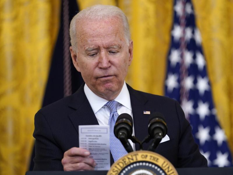 President Biden reads the number of COVID-19 deaths from a card he keeps in his pocket on July 29, 2021. President Biden reads the number of COVID-19 deaths from a card he keeps in his pocket on July 29, 2021.