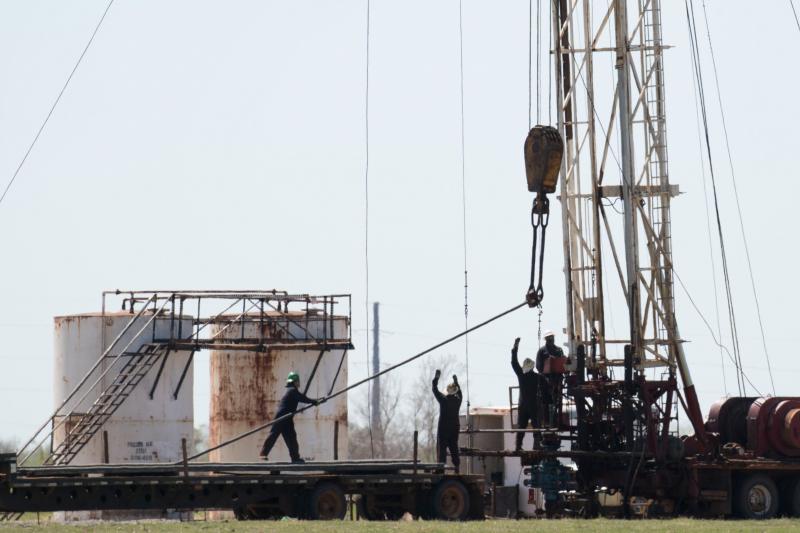 Workers pull pipes from an oil well in 2016 near Crescent, Okla. The oil industry wants to attract a new, more diverse generation of workers, but a history of racism and sexism makes that difficult. Workers pull pipes from an oil well in 2016 near Crescent, Okla. The oil industry wants to attract a new, more diverse generation of workers, but a history of racism and sexism makes that difficult.