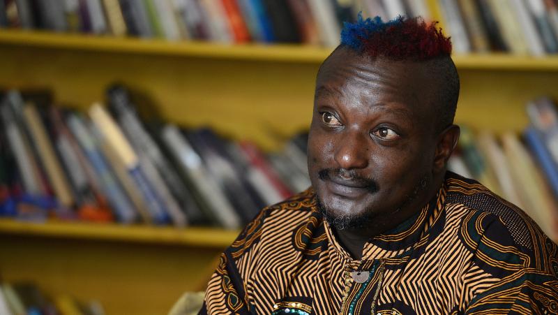 Kenyan author Binyavanga Wainaina, seen here during a January 2014 interview in Nairobi, has died at the age of 48. A founder of the Nairobi-based literary network Kwani?, Wainaina had come out as gay in a country where homosexuality was illegal. Kenyan author Binyavanga Wainaina, seen here during a January 2014 interview in Nairobi, has died at the age of 48. A founder of the Nairobi-based literary network Kwani?, Wainaina had come out as gay in a country where homosexuality was illegal.