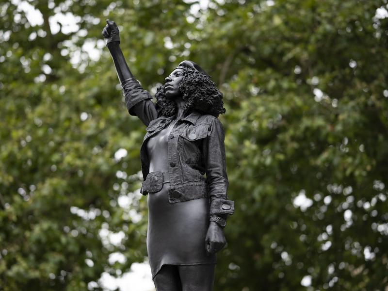 A new sculpture by local artist Marc Quinn, depicting Black Lives Matter protester Jen Reid, stands on the plinth where the Edward Colston statue used to rest in Bristol. A new sculpture by local artist Marc Quinn, depicting Black Lives Matter protester Jen Reid, stands on the plinth where the Edward Colston statue used to rest in Bristol.
