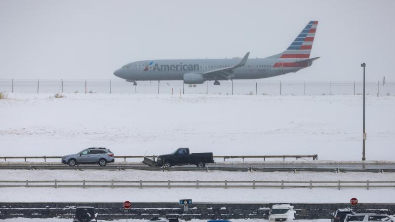 A jet waits for takeoff Tuesday at Denver International Airport, where travelers have seen hundreds of flights canceled amid heavy snow. A jet waits for takeoff Tuesday at Denver International Airport, where travelers have seen hundreds of flights canceled amid heavy snow.