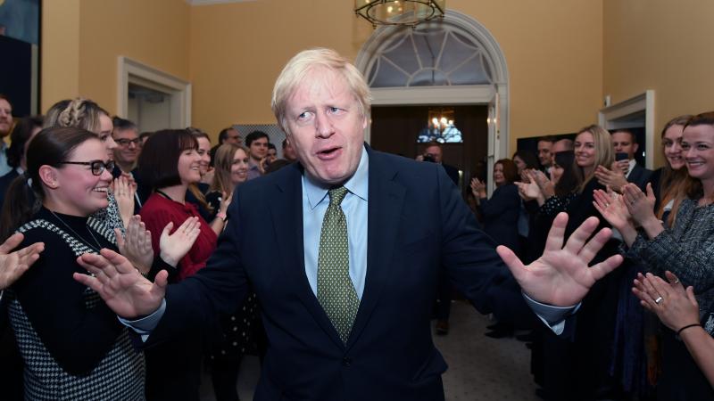 Prime Minister Boris Johnson and his staff returns to 10 Downing Street after visiting Buckingham Palace, where he was given permission to form the next government during an audience with Queen Elizabeth II. Prime Minister Boris Johnson and his staff returns to 10 Downing Street after visiting Buckingham Palace, where he was given permission to form the next government during an audience with Queen Elizabeth II.