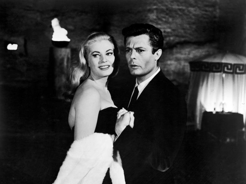 Italian actor Marcello Mastroianni and Swedish actor Anita Ekberg hold hands in a scene from Federico Fellini's 1960 film La Dolce Vita. Italian actor Marcello Mastroianni and Swedish actor Anita Ekberg hold hands in a scene from Federico Fellini's 1960 film La Dolce Vita.