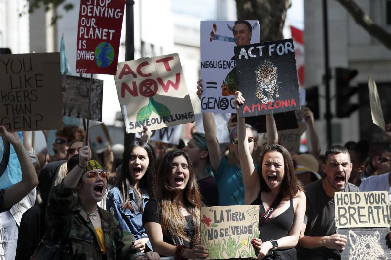 Extinction Rebellion activists protest outside the Brazilian Embassy in London on Friday, calling on President Jair Bolsonaro to act to protect the Amazon rainforest. The European Union is throwing its weight behind French President Emmanuel Macron's call Extinction Rebellion activists protest outside the Brazilian Embassy in London on Friday, calling on President Jair Bolsonaro to act to protect the Amazon rainforest. The European Union is throwing its weight behind French President Emmanuel Macron's call