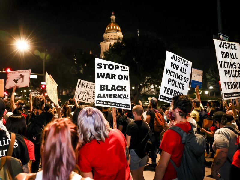 People protest the grand jury decision in the Breonna Taylor case in front of the Colorado state Capitol in Denver on Wednesday. As the protest was breaking up, a motorist drove through a small crowd of protesters who had yelled at the driver to turn arou People protest the grand jury decision in the Breonna Taylor case in front of the Colorado state Capitol in Denver on Wednesday. As the protest was breaking up, a motorist drove through a small crowd of protesters who had yelled at the driver to turn arou