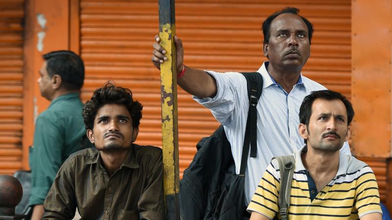 People watch stock prices on a digital broadcast outside the Bombay Stock Exchange on Friday. Currency, equity and oil markets around the world are feeling the effects of the British vote to leave the EU. People watch stock prices on a digital broadcast outside the Bombay Stock Exchange on Friday. Currency, equity and oil markets around the world are feeling the effects of the British vote to leave the EU.