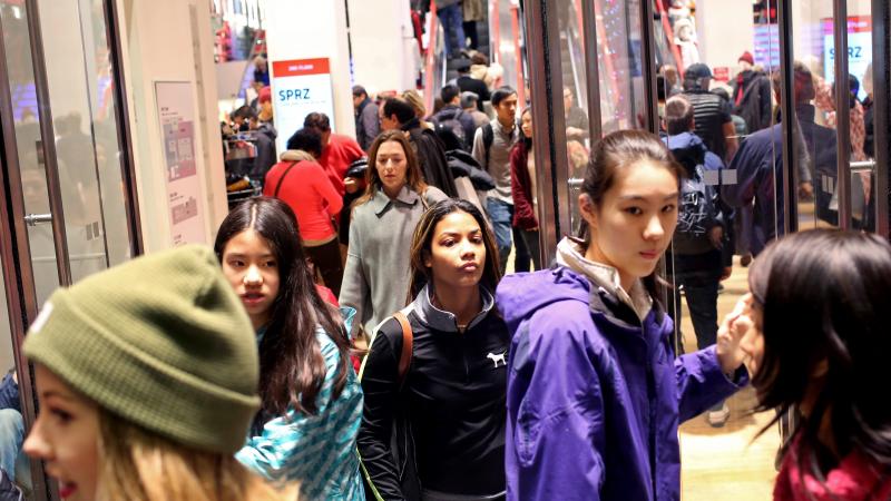 Shoppers walk out of Uniqlo on 5th Ave. in New York City on Black Friday, Nov. 27. Shoppers walk out of Uniqlo on 5th Ave. in New York City on Black Friday, Nov. 27.