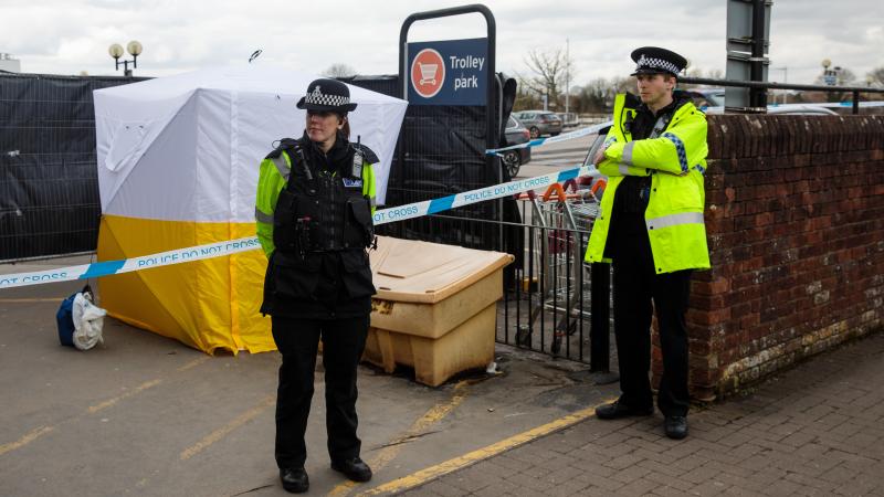 Police officers stand guard near a forensics tent in a Sainsbury's parking lot on Tuesday, as investigations continue more than a week after the poisoning of Sergei Skripal and his daughter in Salisbury, England. Police officers stand guard near a forensics tent in a Sainsbury's parking lot on Tuesday, as investigations continue more than a week after the poisoning of Sergei Skripal and his daughter in Salisbury, England.
