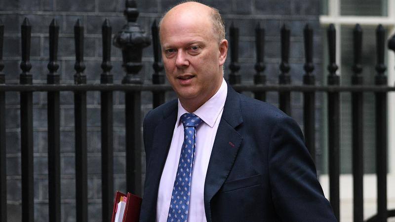 British Transport Secretary Chris Grayling, seen here after a Cabinet meeting at 10 Downing Street, is seen opening his car door on a passing cyclist in a video that was captured by a bike rider in London. British Transport Secretary Chris Grayling, seen here after a Cabinet meeting at 10 Downing Street, is seen opening his car door on a passing cyclist in a video that was captured by a bike rider in London.