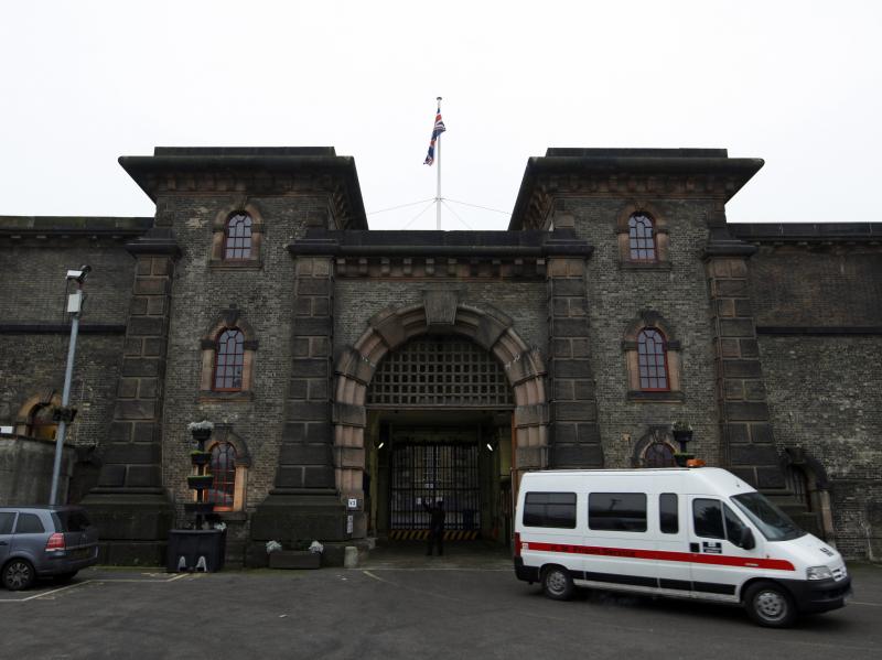 Wandsworth prison in south London in a 2010 photo. Neil Moore, a 28-year-old convicted fraudster, walked out of the prison earlier this month by showing guards a bail letter he'd forged. Wandsworth prison in south London in a 2010 photo. Neil Moore, a 28-year-old convicted fraudster, walked out of the prison earlier this month by showing guards a bail letter he'd forged.