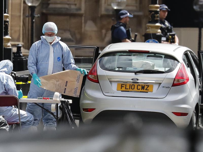 Forensics officers work near the car that crashed into security barriers outside the Houses of Parliament in London on Tuesday. British media report that Salih Khater has been arrested on charges of terrorism. Forensics officers work near the car that crashed into security barriers outside the Houses of Parliament in London on Tuesday. British media report that Salih Khater has been arrested on charges of terrorism.