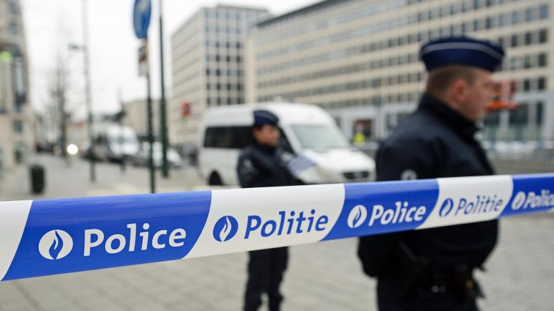Police patrol outside the council chamber of Brussels on Thursday during ongoing investigations into the Paris and Brussels terrorist attacks. More than 30 people have been identified as being involved in a network behind the Paris attacks on Nov. 13, wit Police patrol outside the council chamber of Brussels on Thursday during ongoing investigations into the Paris and Brussels terrorist attacks. More than 30 people have been identified as being involved in a network behind the Paris attacks on Nov. 13, wit