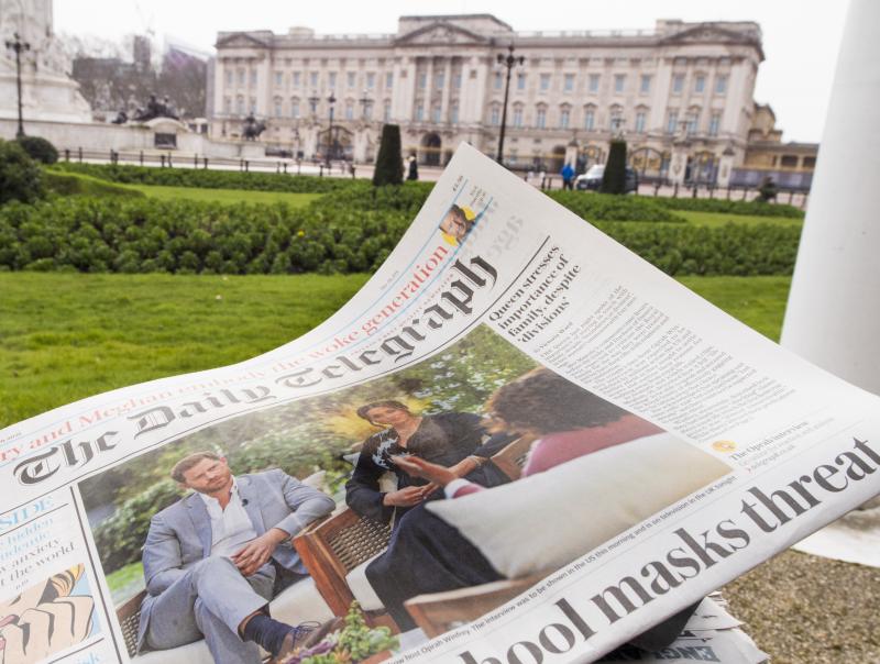 A British newspaper flutters in the wind outside Buckingham Palace in London the day after the Duke and Duchess of Sussex's interview with Oprah Winfrey. A British newspaper flutters in the wind outside Buckingham Palace in London the day after the Duke and Duchess of Sussex's interview with Oprah Winfrey.