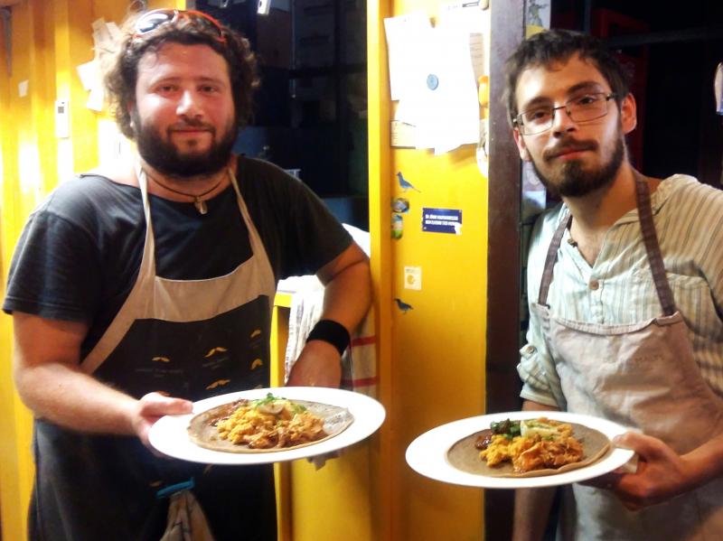 Andris Roder (left) and Adam Finding, cooks at the Kisuzem restaurant in Budapest, prepare a traditional Eritrean meal of injera bread, chickpea paste and meat stew. Their restaurant served up Eritrean food all week for a food festival in solidarity with Andris Roder (left) and Adam Finding, cooks at the Kisuzem restaurant in Budapest, prepare a traditional Eritrean meal of injera bread, chickpea paste and meat stew. Their restaurant served up Eritrean food all week for a food festival in solidarity with