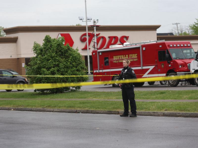 Police continue the investigation at the Tops supermarket May 18 in the Cold Spring neighborhood of Buffalo, N.Y. A gunman opened fire at the store on Saturday, killing 10 people and wounding three others. Police say it's being investigated as a racially Police continue the investigation at the Tops supermarket May 18 in the Cold Spring neighborhood of Buffalo, N.Y. A gunman opened fire at the store on Saturday, killing 10 people and wounding three others. Police say it's being investigated as a racially