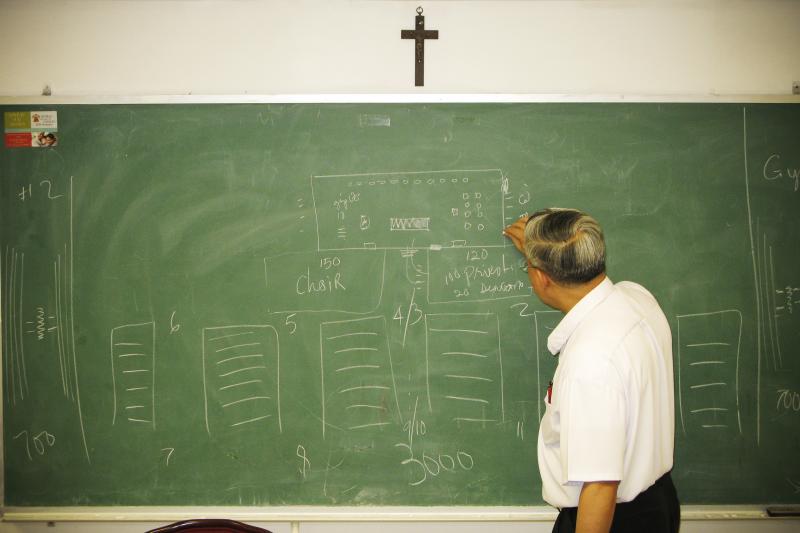 The Rev. Joseph Trinh, the senior priest at St. Helena, meets with the liturgy and decorations committee planning a Mass for Vietnamese Catholics during Pope Francis' visits to the city later this month. The Rev. Joseph Trinh, the senior priest at St. Helena, meets with the liturgy and decorations committee planning a Mass for Vietnamese Catholics during Pope Francis' visits to the city later this month.