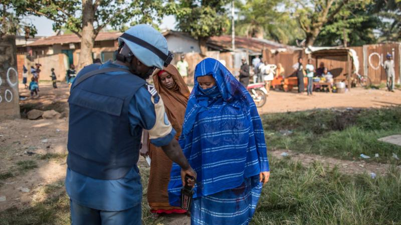 A Burundian soldier of the U.N. peacekeeping force MINUSCA contingent uses a metal detector at the entrance of a polling station in Bangui, Central African Republic on Dec. 14, 2015. A Burundian soldier of the U.N. peacekeeping force MINUSCA contingent uses a metal detector at the entrance of a polling station in Bangui, Central African Republic on Dec. 14, 2015.