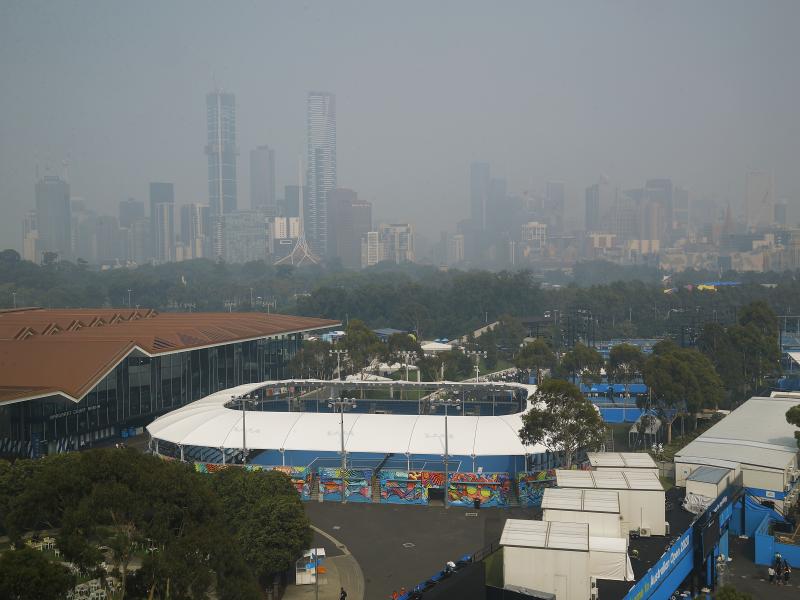 Smoke from bushfires shrouds the Melbourne city skyline. Hazardous breathing conditions prompted Australian Open officials to suspend practice sessions on Tuesday. Smoke from bushfires shrouds the Melbourne city skyline. Hazardous breathing conditions prompted Australian Open officials to suspend practice sessions on Tuesday.