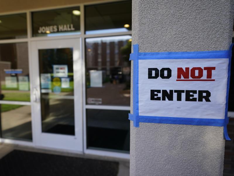 The doorway to Jones Hall is shown at Utah State University in September, where about 300 students were being quarantined to their rooms as a precaution. The doorway to Jones Hall is shown at Utah State University in September, where about 300 students were being quarantined to their rooms as a precaution.