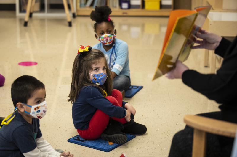 Prekindergarten students listen as their teacher reads a story this month at Dawes Elementary School in Chicago. Prekindergarten students listen as their teacher reads a story this month at Dawes Elementary School in Chicago.