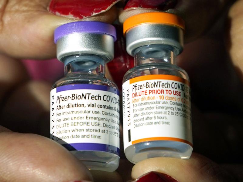 A nurse holds a vial of the Pfizer COVID-19 vaccine for children ages 5 to 11, right, and a vial of the vaccine for adults, which has a different colored label, at a vaccination station in Jackson, Miss. on Feb. 8, 2022. A nurse holds a vial of the Pfizer COVID-19 vaccine for children ages 5 to 11, right, and a vial of the vaccine for adults, which has a different colored label, at a vaccination station in Jackson, Miss. on Feb. 8, 2022.