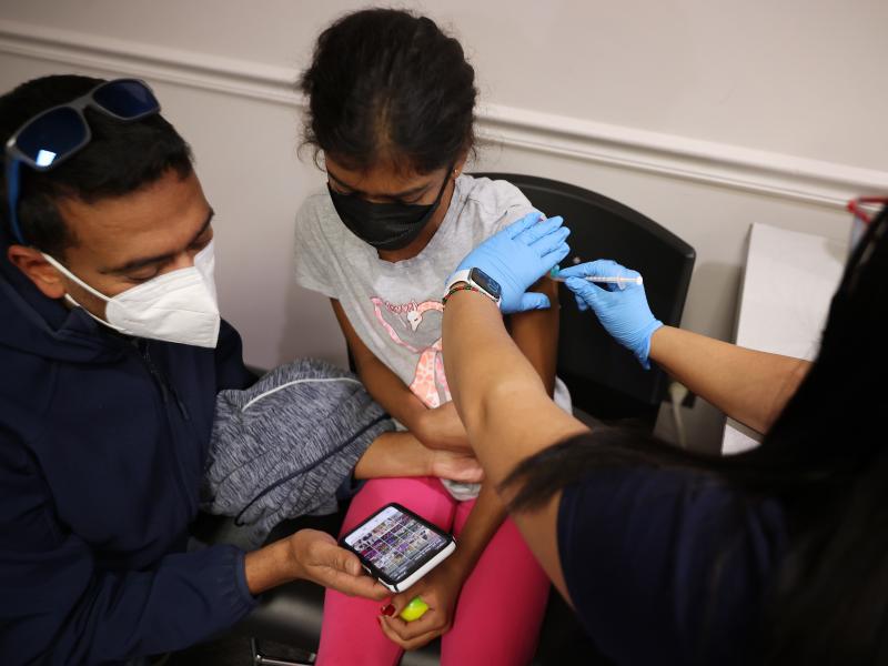 A child receives the Pfizer BioNTech vaccine at the Fairfax County Government Center in Annandale, Va., last November. Vaccines will soon be available for children as young as 6 months old. A child receives the Pfizer BioNTech vaccine at the Fairfax County Government Center in Annandale, Va., last November. Vaccines will soon be available for children as young as 6 months old.