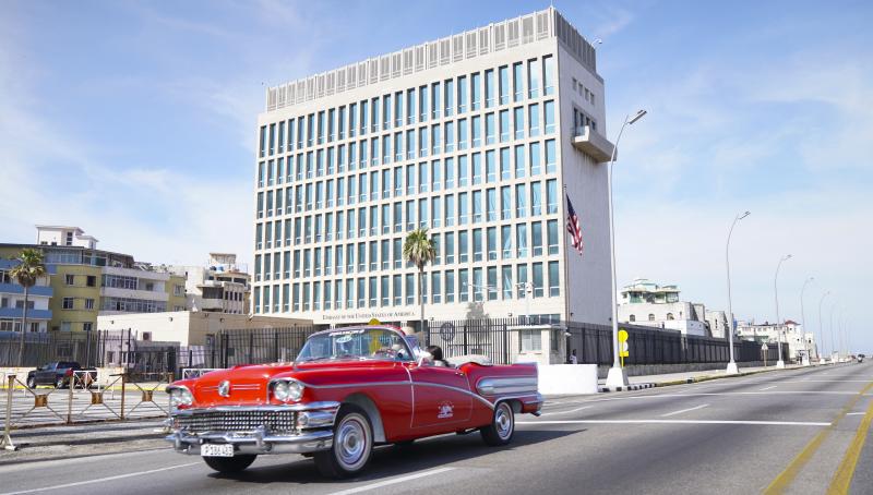 A car drives past the U.S. Embassy in Havana in 2019. Americans working at the embassy began reporting unexplained illnesses in 2016. A car drives past the U.S. Embassy in Havana in 2019. Americans working at the embassy began reporting unexplained illnesses in 2016.