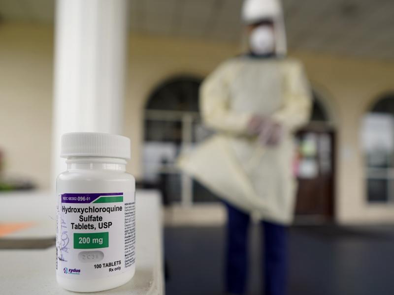 A bottle of hydroxycloroquine sits on a table outside the entrance to The Resort at Texas City nursing home, where Robin Armstrong, a doctor and the home's medical director, is giving the drug to residents A bottle of hydroxycloroquine sits on a table outside the entrance to The Resort at Texas City nursing home, where Robin Armstrong, a doctor and the home's medical director, is giving the drug to residents