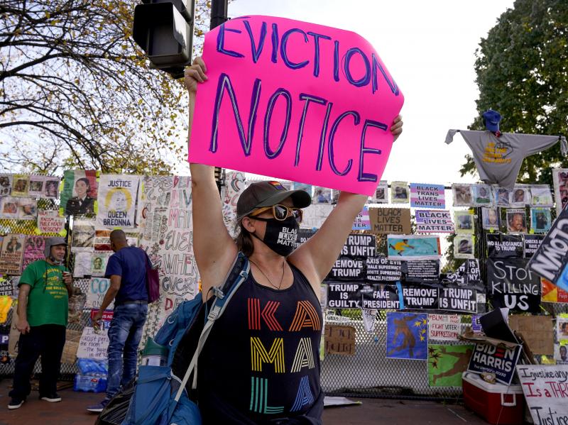A protester holds up an eviction-related sign in Washington, D.C. The coronavirus rescue package just passed in Congress sets aside $25 billion for rental assistance and extends a CDC order aimed at preventing evictions. A protester holds up an eviction-related sign in Washington, D.C. The coronavirus rescue package just passed in Congress sets aside $25 billion for rental assistance and extends a CDC order aimed at preventing evictions.