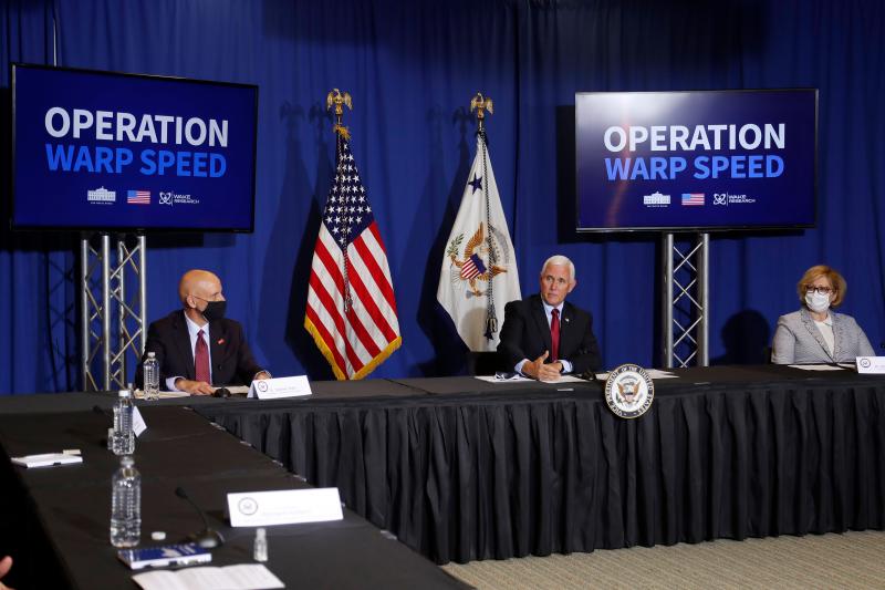 FDA Commissioner Stephen Hahn (left), Vice President Mike Pence, and Dr. Ella Grach, CEO of Wake Research, at the NC Biotechnology Center in July, where Phase 3 trials for a coronavirus vaccine candidate are underway. FDA Commissioner Stephen Hahn (left), Vice President Mike Pence, and Dr. Ella Grach, CEO of Wake Research, at the NC Biotechnology Center in July, where Phase 3 trials for a coronavirus vaccine candidate are underway.
