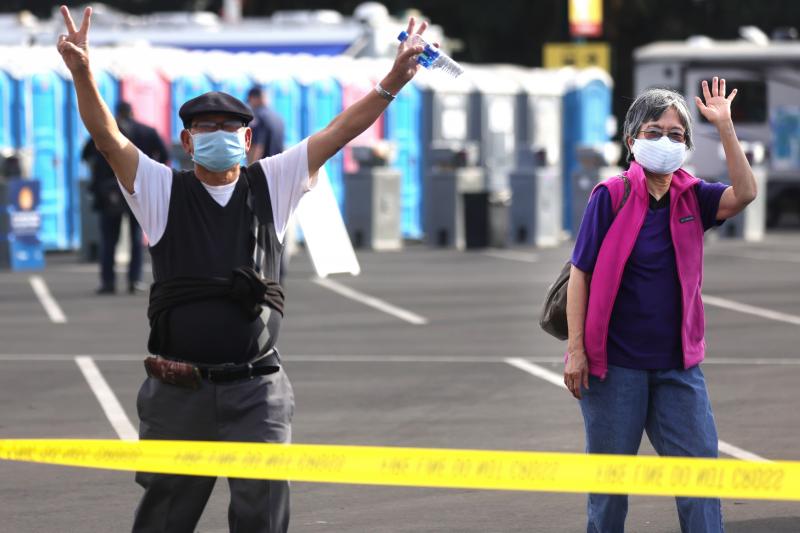Southern Californians celebrate at a mass vaccination site in Disneyland's parking lot in January. CDC head Dr. Rochelle Walensky cautions that for strongest immunity, recipients get both doses of the Pfizer or of the Moderna vaccine. Southern Californians celebrate at a mass vaccination site in Disneyland's parking lot in January. CDC head Dr. Rochelle Walensky cautions that for strongest immunity, recipients get both doses of the Pfizer or of the Moderna vaccine.