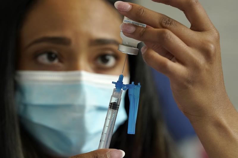Licensed practical nurse Yokasta Castro, of Warwick, R.I., draws a Moderna COVID-19 vaccine into a syringe. The vaccines have now been linked to minor changes in menstruation, but are still considered safe. Licensed practical nurse Yokasta Castro, of Warwick, R.I., draws a Moderna COVID-19 vaccine into a syringe. The vaccines have now been linked to minor changes in menstruation, but are still considered safe.