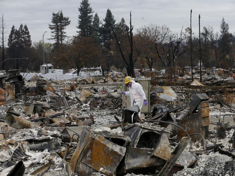 Work crews remove debris at the site of a home destroyed by fires in the Coffey Park area of Santa Rosa, Calif., last month. Thousands of homes and other structures were destroyed by wildfires in the area. Work crews remove debris at the site of a home destroyed by fires in the Coffey Park area of Santa Rosa, Calif., last month. Thousands of homes and other structures were destroyed by wildfires in the area.