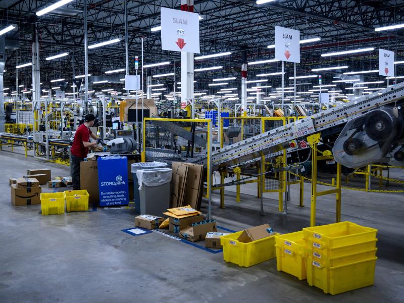 A man works at a conveyor belt at the 855,000-square-foot Amazon warehouse in New York in 2019. A man works at a conveyor belt at the 855,000-square-foot Amazon warehouse in New York in 2019.